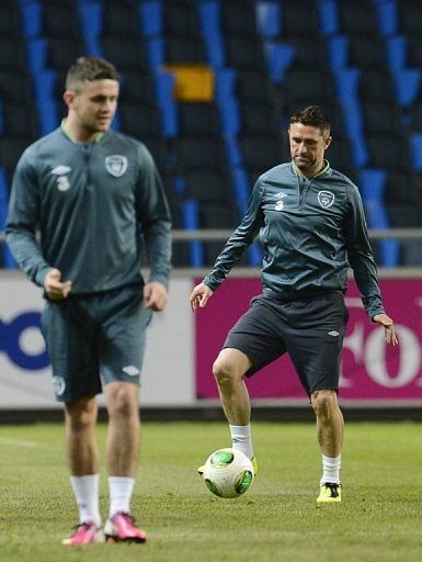 Republic of Ireland striker Robbie Keane (R) takes part in a training session in Stockholm, Sweden, on March 21, 2013